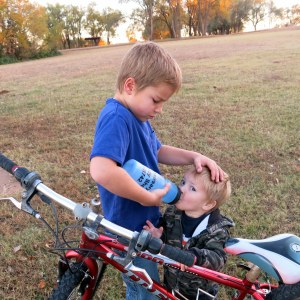 Stuart giving Keane a drink.